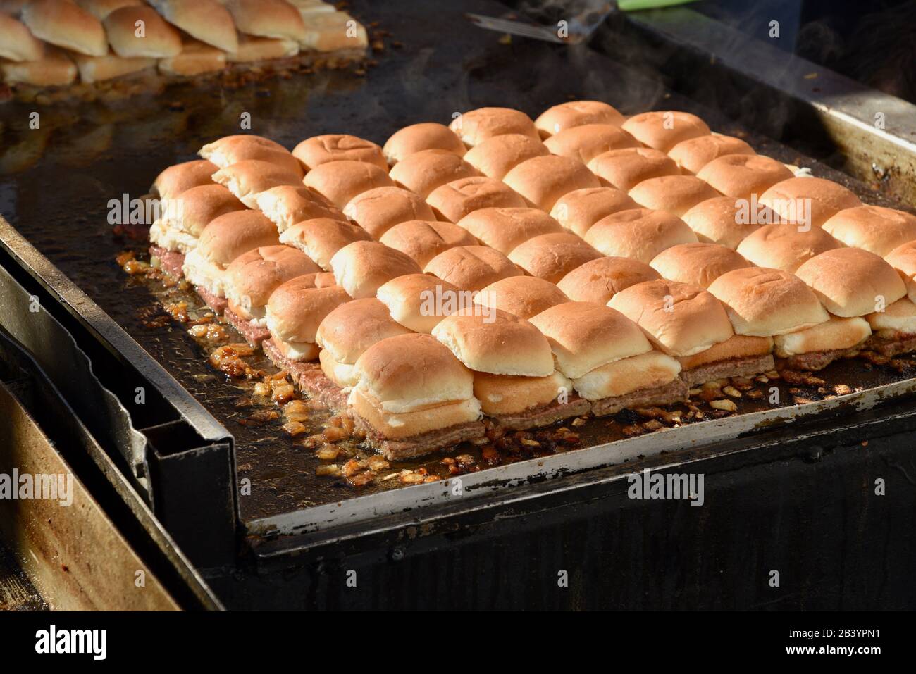 Grilled vegan, plant-based protein (fake meat) 'beef' Impossible Burgers for White Castle sliders sampled by attendees at CES, Las Vegas, NV, USA Stock Photo