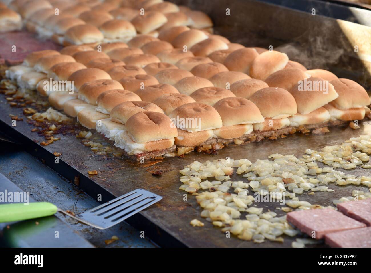 Grilled vegan, plant-based protein (fake meat) 'beef' Impossible Burgers for White Castle sliders sampled by attendees at CES, Las Vegas, NV, USA Stock Photo