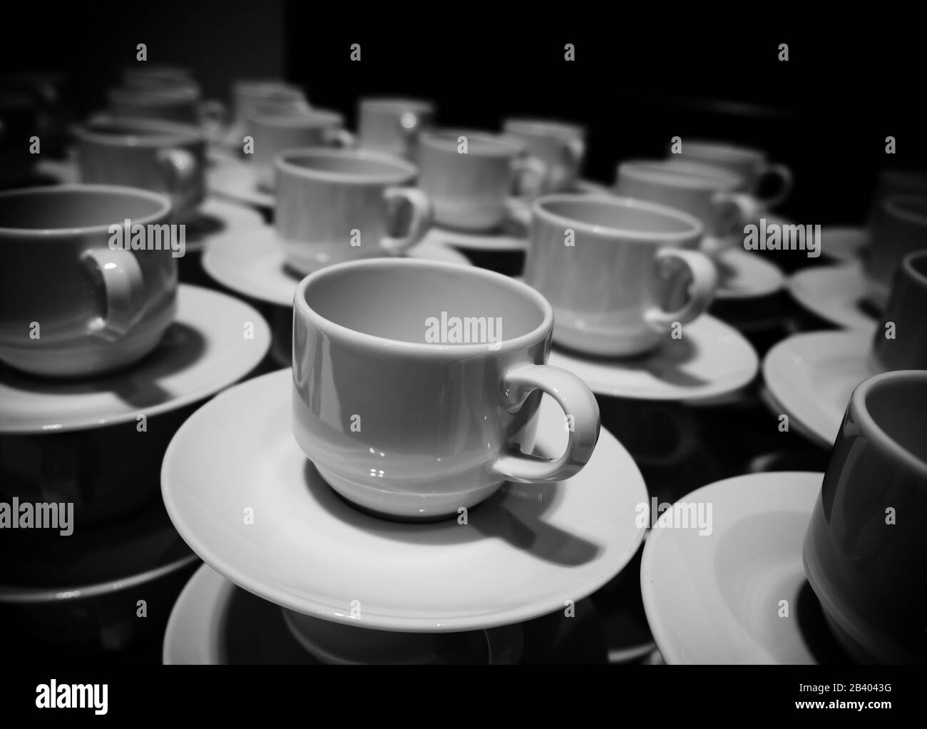 Stacked coffee cups at a meeting Stock Photo Alamy
