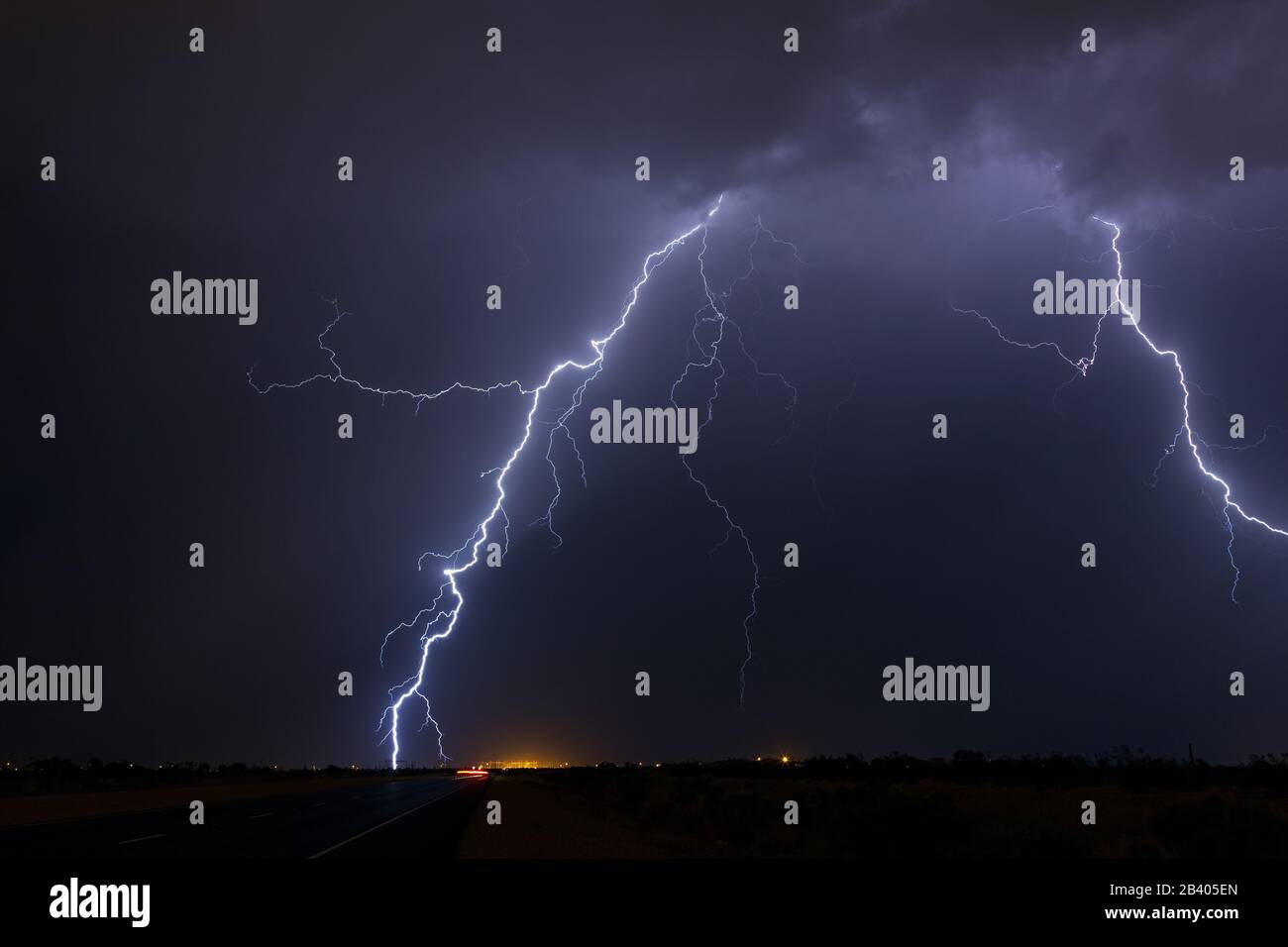 A lightning strike hits an electrical substation during a thunderstorm