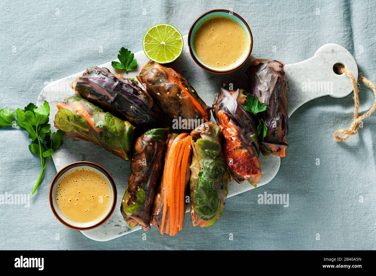 vegan rainbow summer rolls in rice wrapper with spicy almond sauce