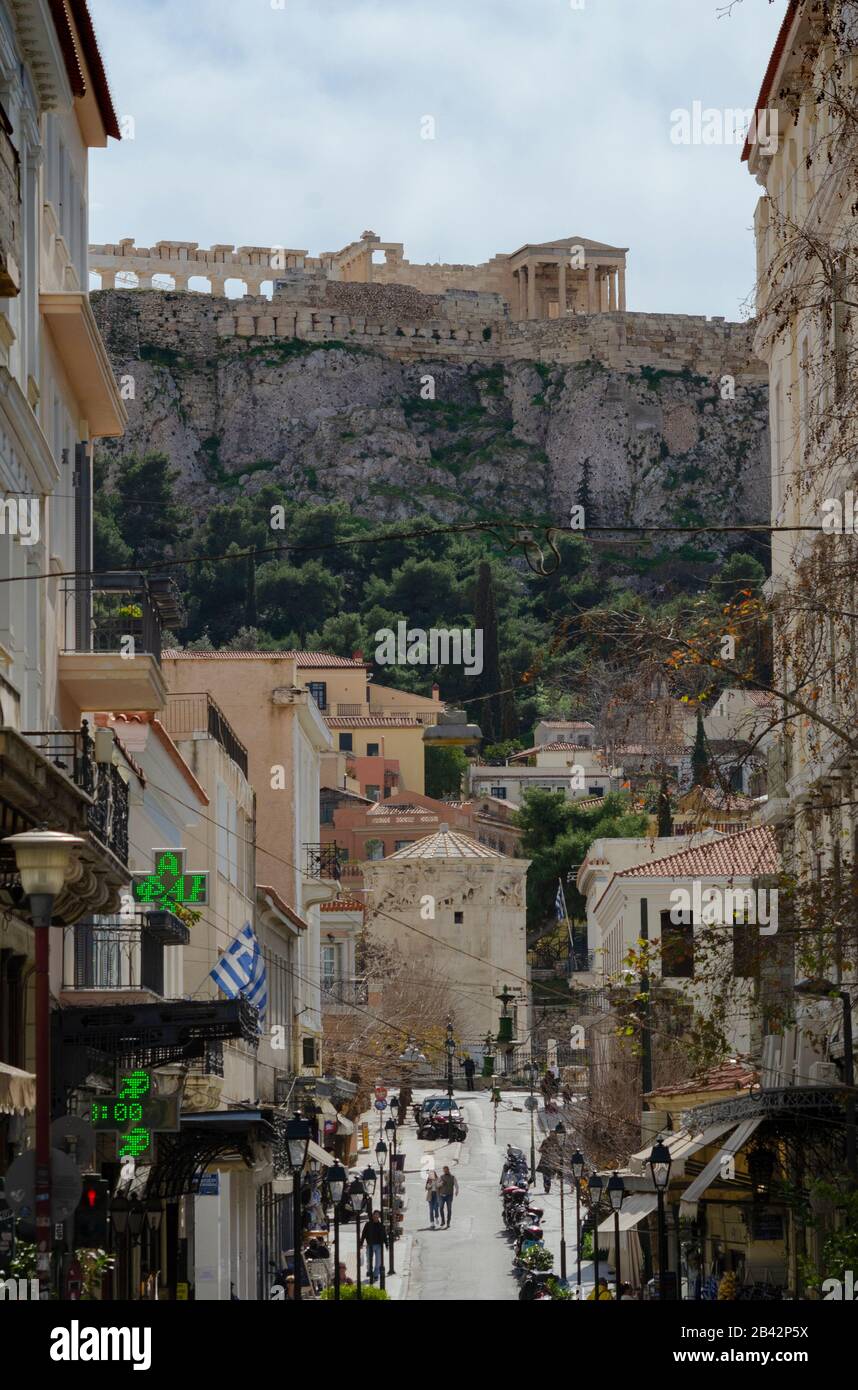 Spring street scene in Plaka Athens Greece with the Parthenon in the background Stock Photo