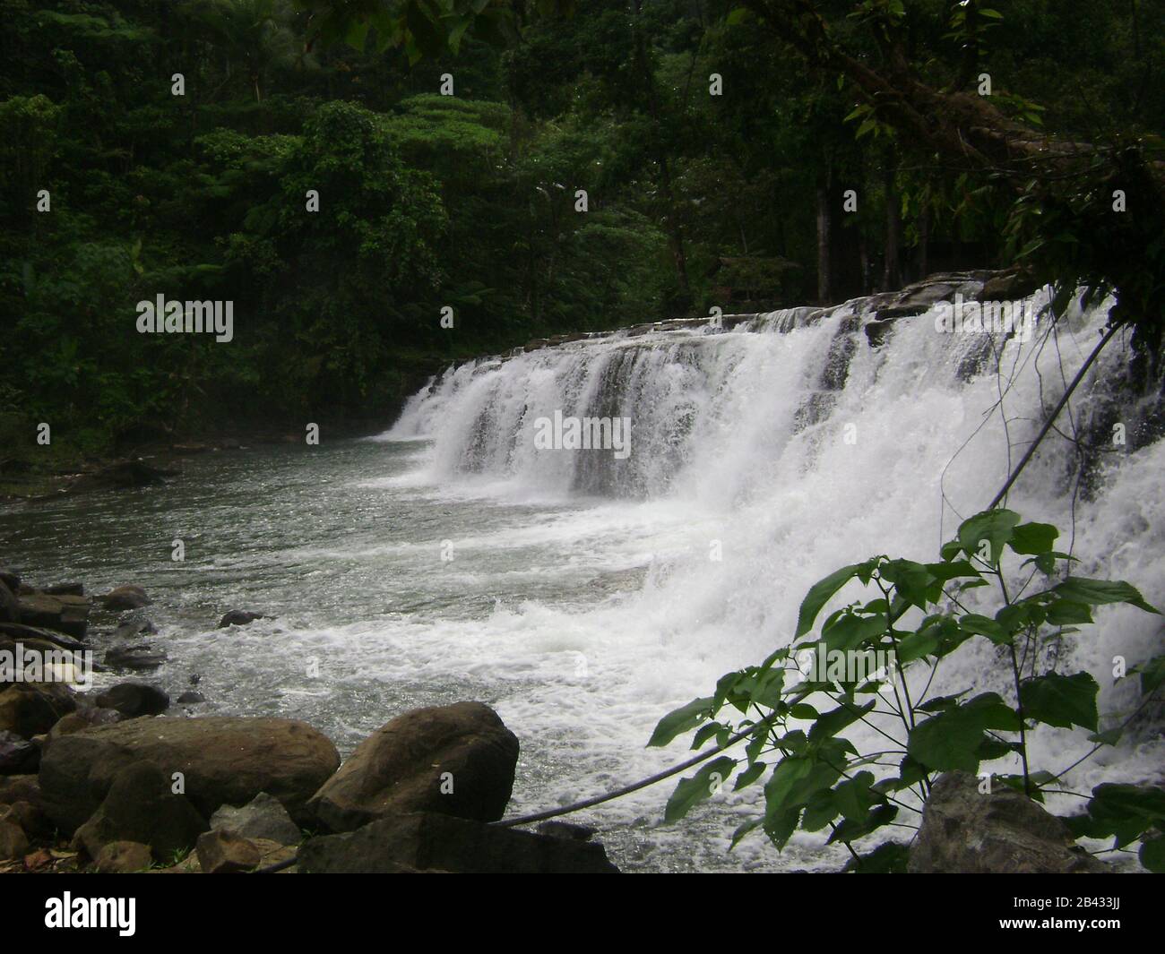 Cascade of water flowing from Tinuy-an Falls, Surigao del Sur, Philippines. Stock Photo