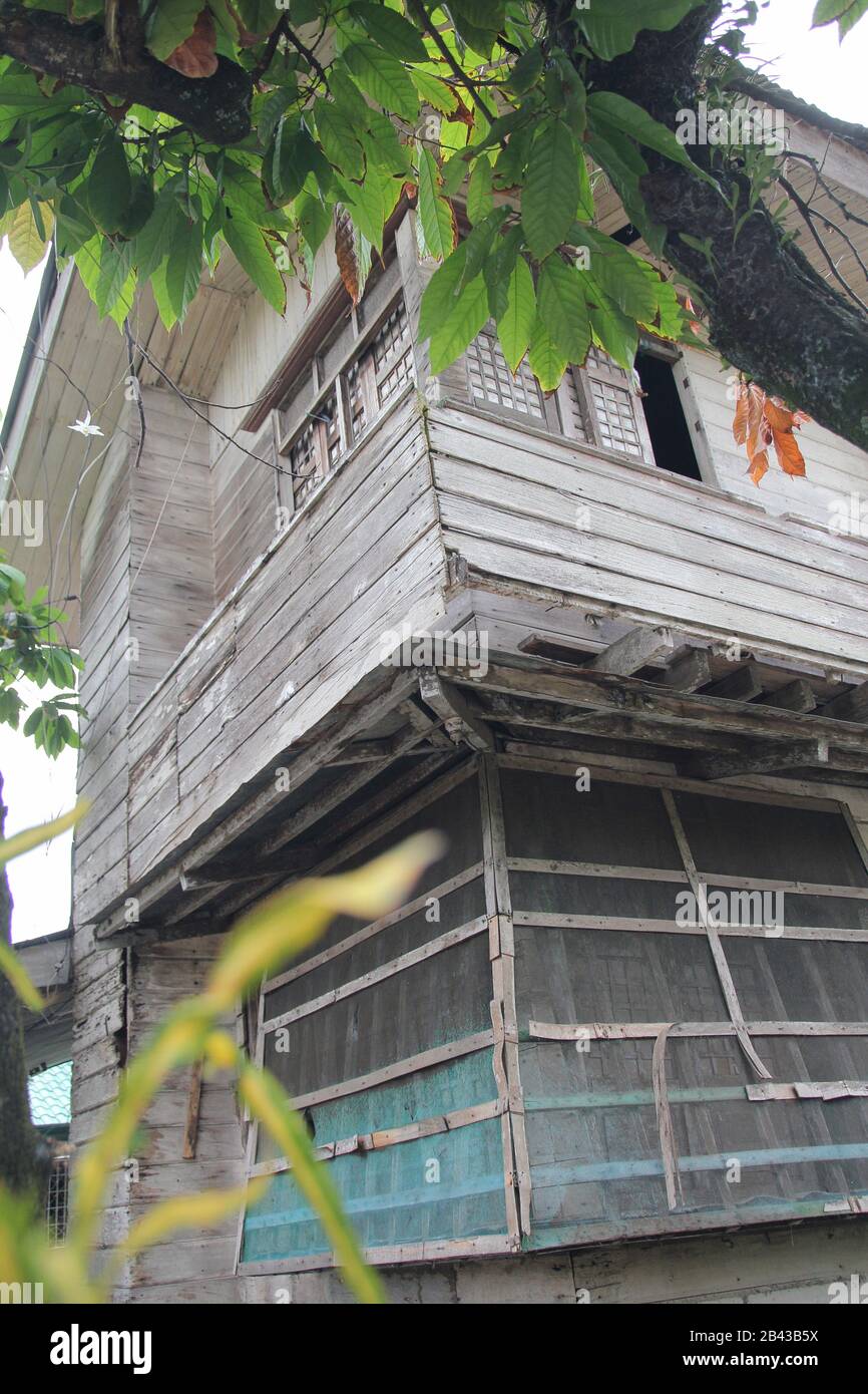 Dilapidated ancestral wooden house in southern Philippines. Stock Photo