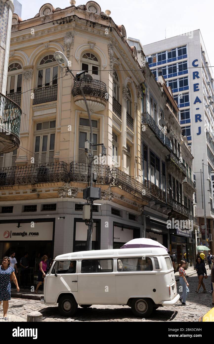 Old and new architecture in the city centre of the Cariocan conglomerate with a white van passing by Stock Photo