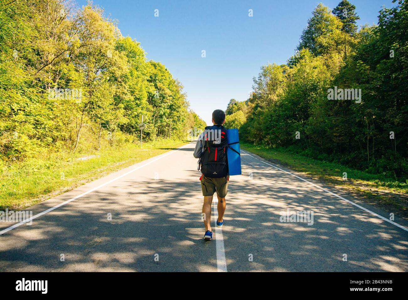 Active man large backpack walks hi-res stock photography and images - Alamy