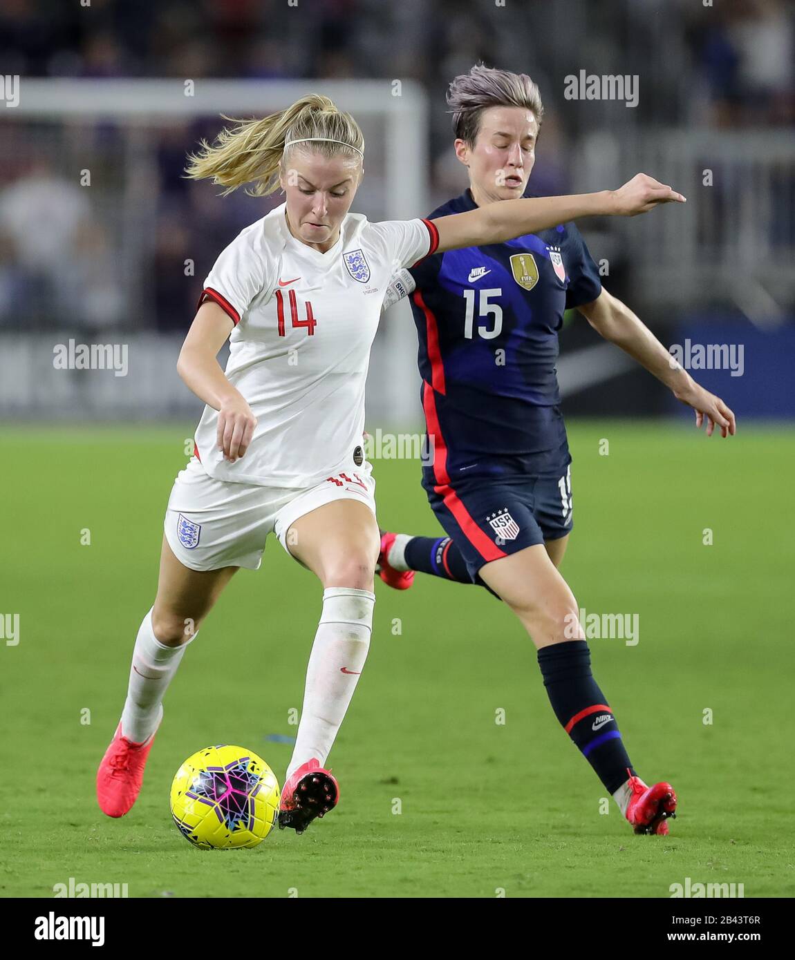 Orlando, Florida, USA. 5th Mar, 2020. England defender LEAH WILLIAMSON (14) competes for the ball against United States forward MEGAN RAPINOE (15) during the SheBelieves Cup United States vs England match at Exploria Stadium in Orlando, Fl on March 5, 2020. Credit: Cory Knowlton/ZUMA Wire/Alamy Live News Stock Photo