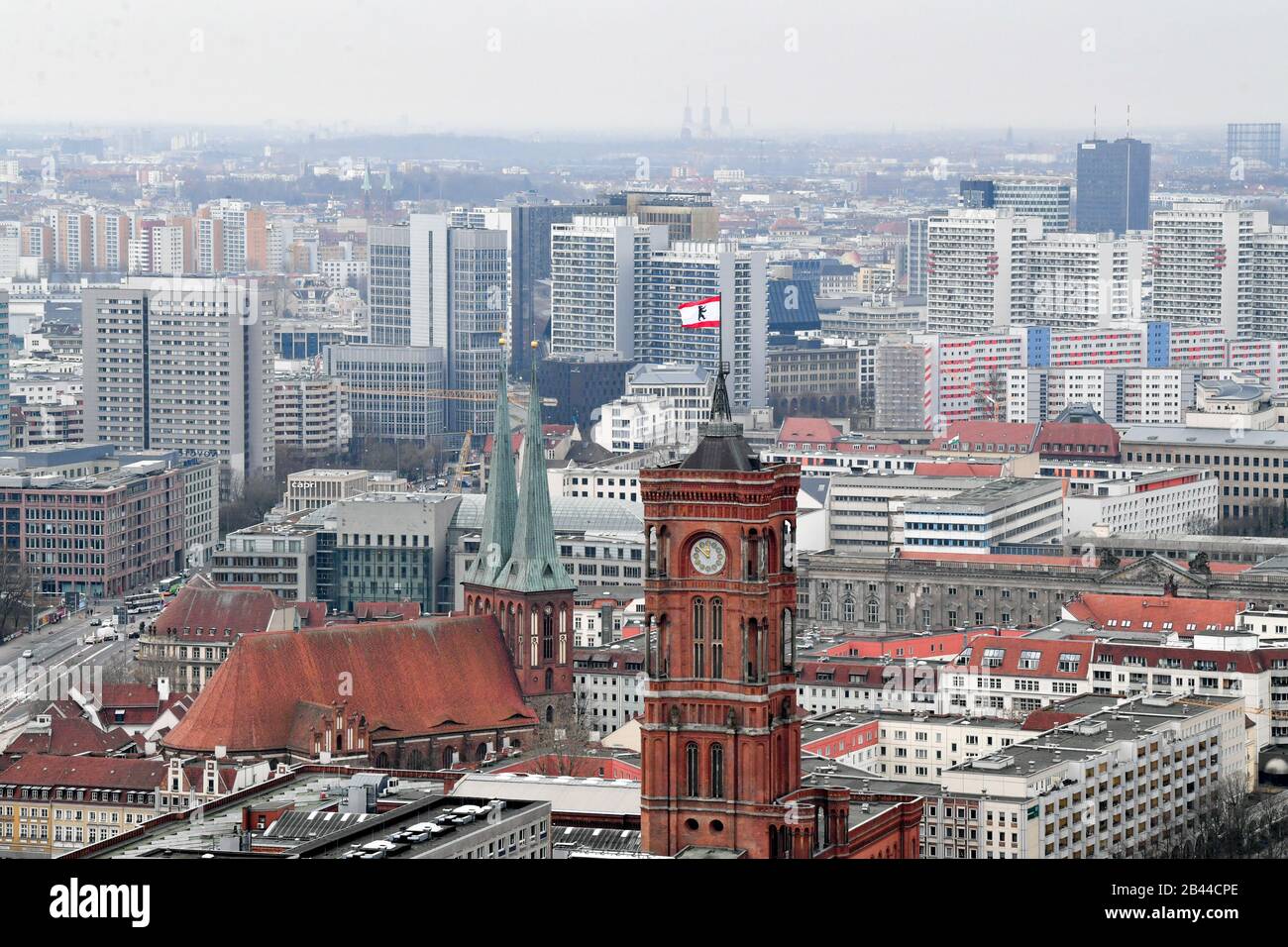 Berlin, Germany. 03rd Mar, 2020. Behind the towers of the Marienkirche (l) and the Rotes Rathaus (Red City Hall), numerous apartment blocks can be seen. On top of the town hall the flag of Berlin is waving. View from Hotel Park Inn. Credit: Jens Kalaene/dpa-Zentralbild/ZB/dpa/Alamy Live News Stock Photo
