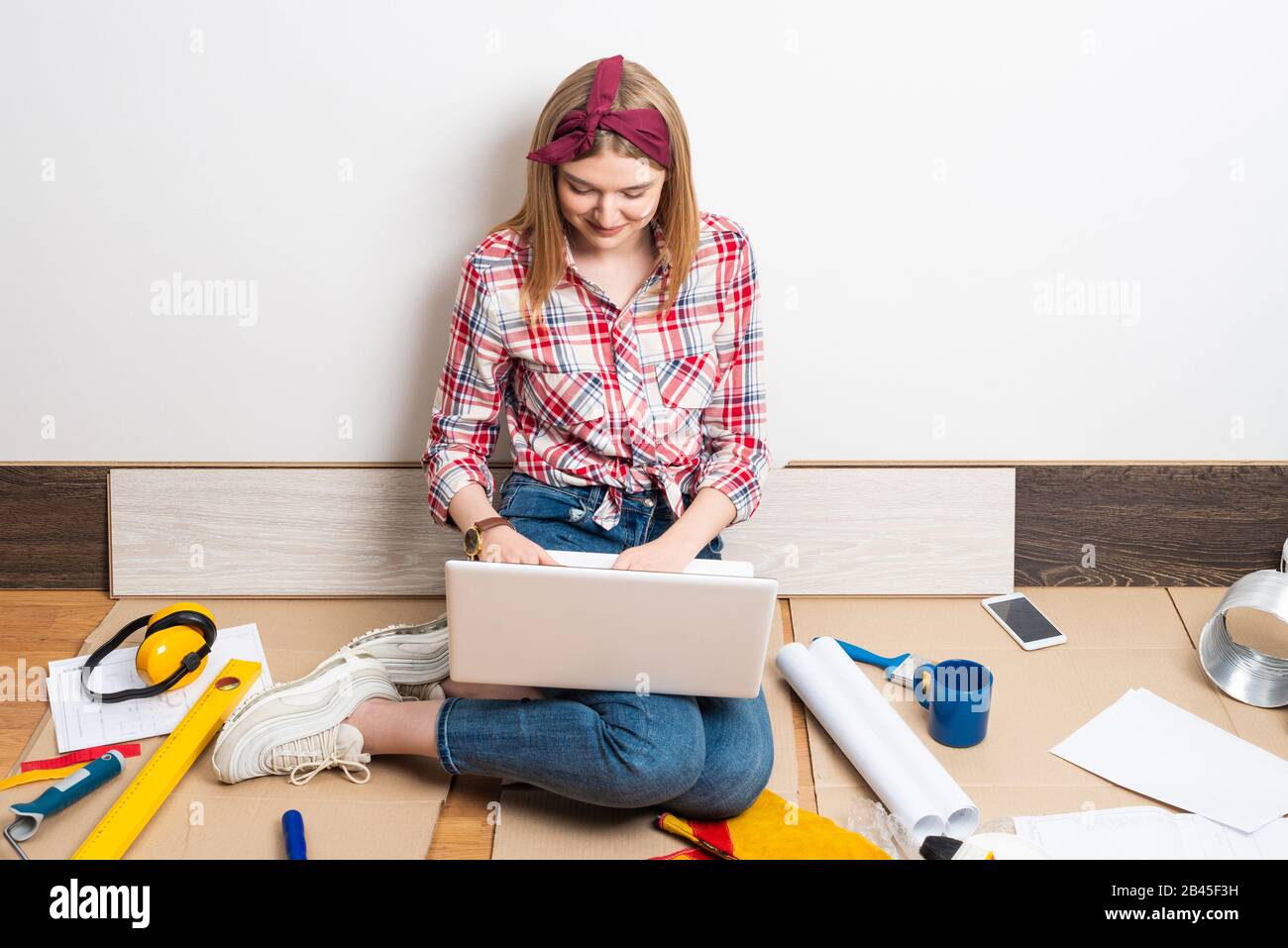 Beautiful girl using laptop computer at home Stock Photo - Alamy