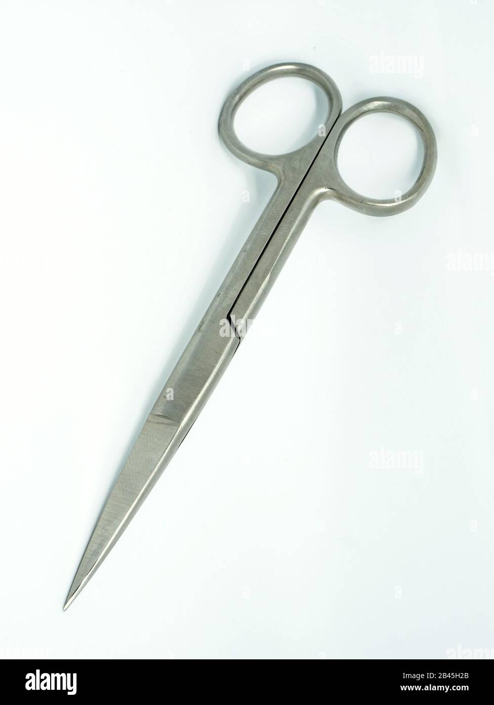 Surgical chrome steel scissors In White Isolated Background Stock Photo