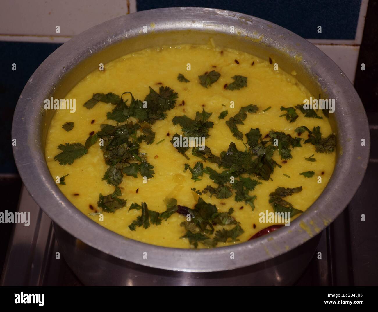 Indian cuisine Khichdi on a round vessel. It is basically rice with yellow lentils Stock Photo