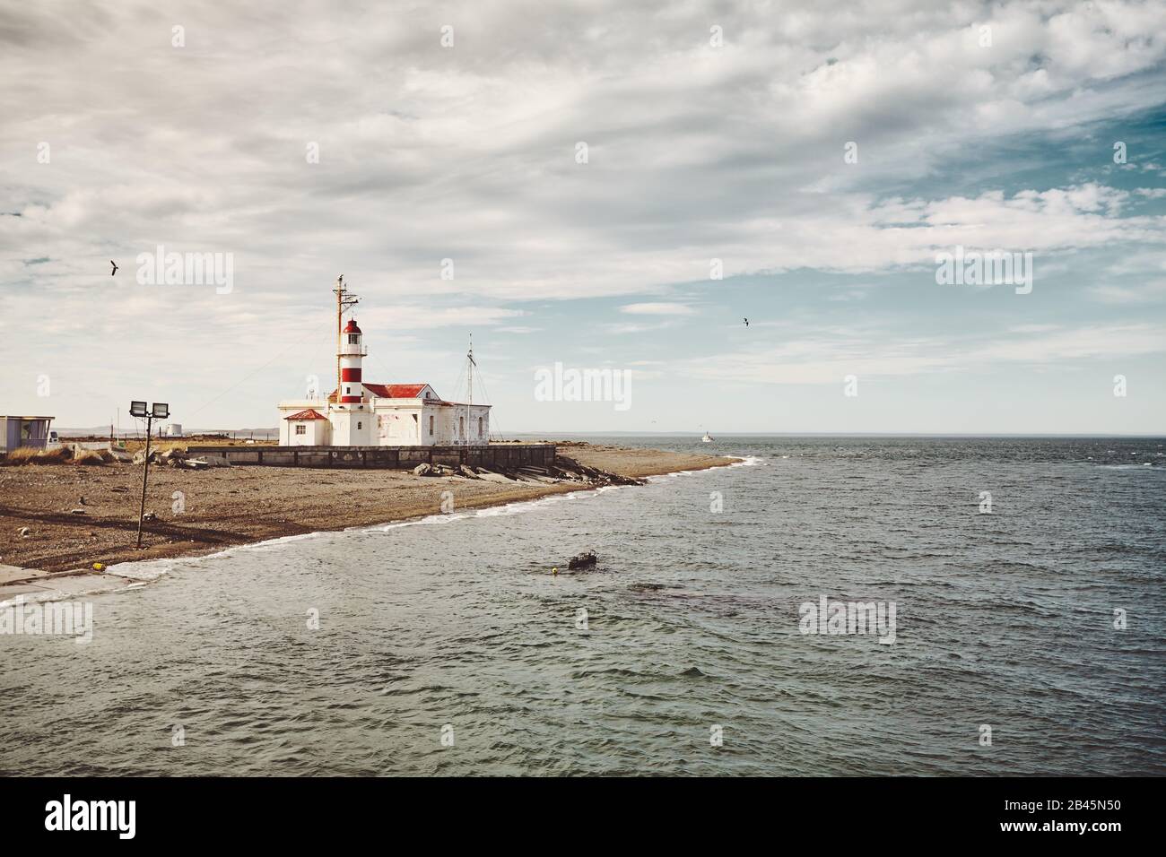 Lighthouse at the end of the world, Punta Delgada along the Strait of Magellan, color toning applied, Chile. Stock Photo