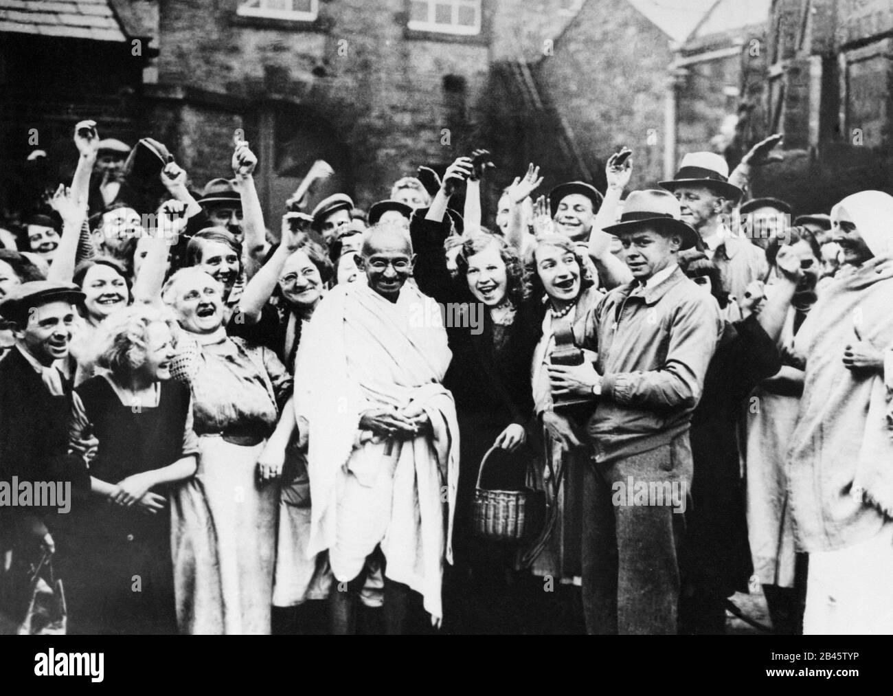 Mahatma Gandhi with mill workers in London, England, United Kingdom, UK, 1931, old vintage 1900s picture Stock Photo
