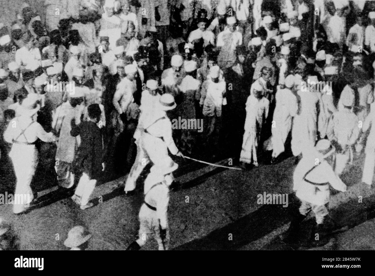 British police caning lathi charge Indian freedom fighters, India, Asia, 1925, old vintage 1900s picture Stock Photo