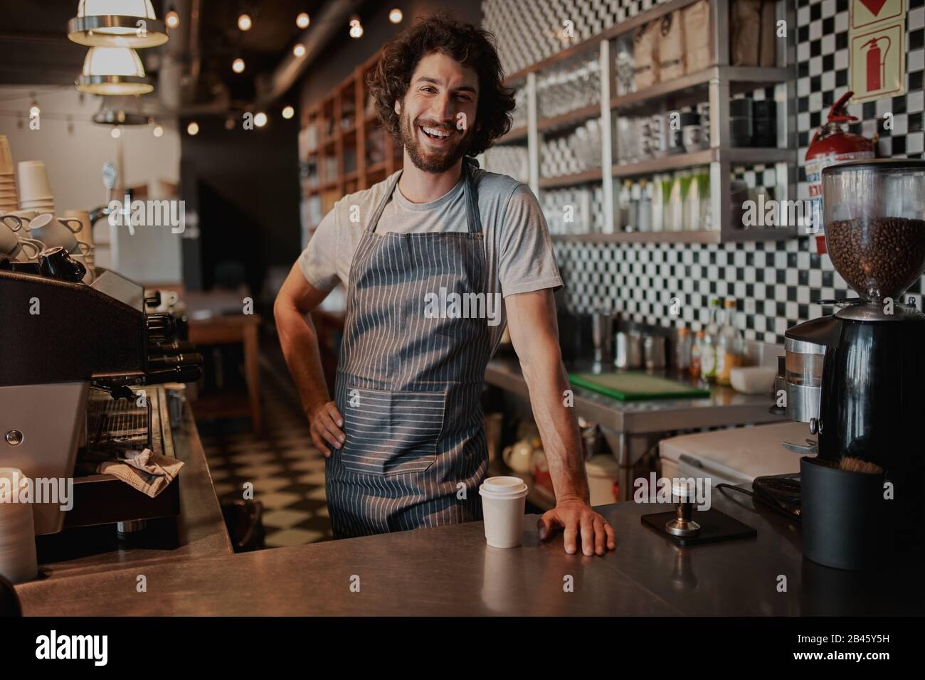 Handsome barista in uniform hi-res stock photography and images - Alamy