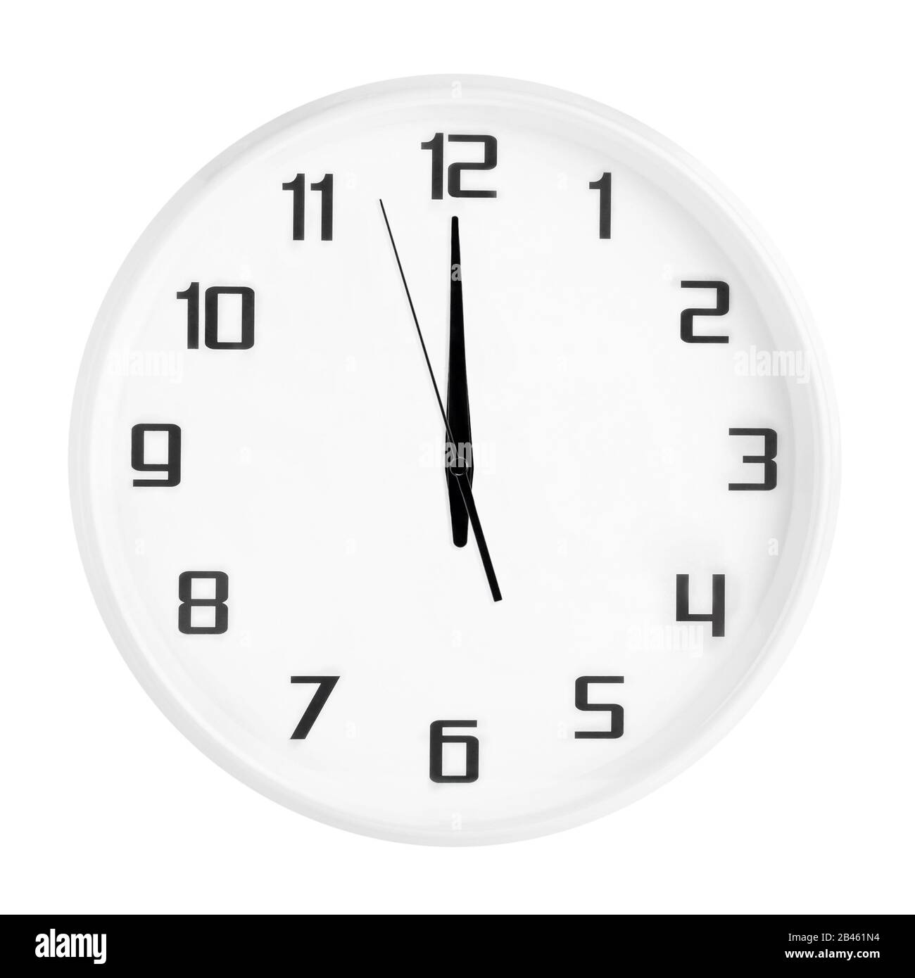 White round office clock showing twelve o'clock isolated on white background. Stock Photo
