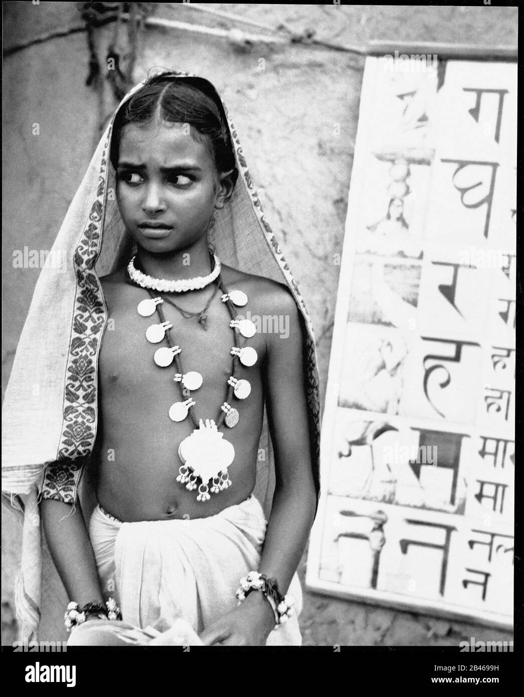 Indian rural village girl wearing silver necklace, Uttar Pradesh, India, Asia, 1953, old vintage 1900s picture Stock Photo