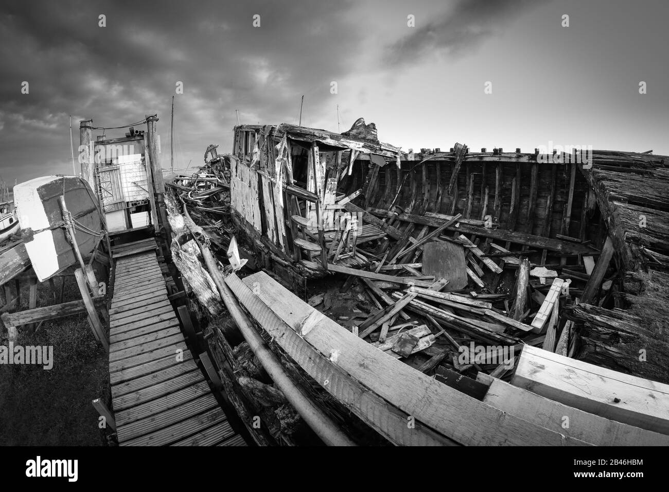 The rotting remains of an abandoned boat on the shore of the River Wyre