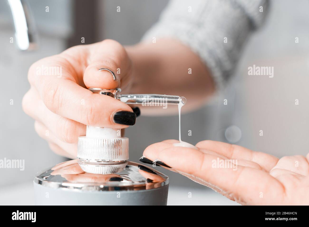 Effective handwashing techniques Woman soaping her hands through a