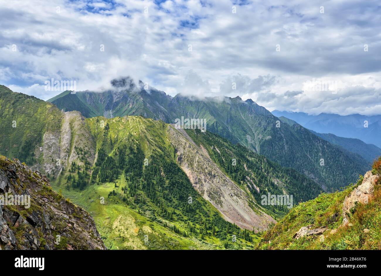 Overcast clouds over mountain ranges Stock Photo