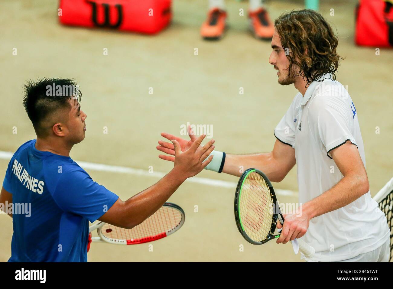 Manila. 6th Mar, 2020. Stefanos Tsitsipas (R) of Greece greets Alberto Lim of the Philippines after the singles match of Davis Cup World Group II play-off round between the Philippines and Greece in Manila, the Philippines on March 6, 2020. Credit: Rouelle Umali/Xinhua/Alamy Live News Stock Photo