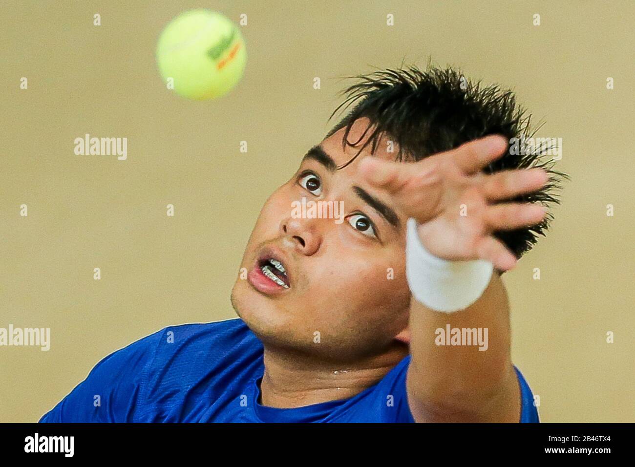 Manila. 6th Mar, 2020. Alberto Lim of the Philippines serves during the singles match against Stefanos Tsitsipas of Greece at Davis Cup World Group II play-off round between the Philippines and Greece in Manila, the Philippines on March 6, 2020. Credit: Rouelle Umali/Xinhua/Alamy Live News Stock Photo