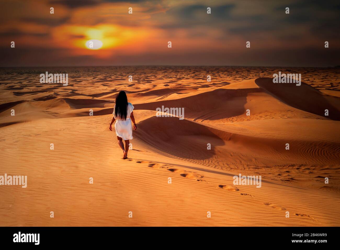Dubai dessert sand dunes, couple on Dubai desert safari,United Arab Emirates, woman vacation in