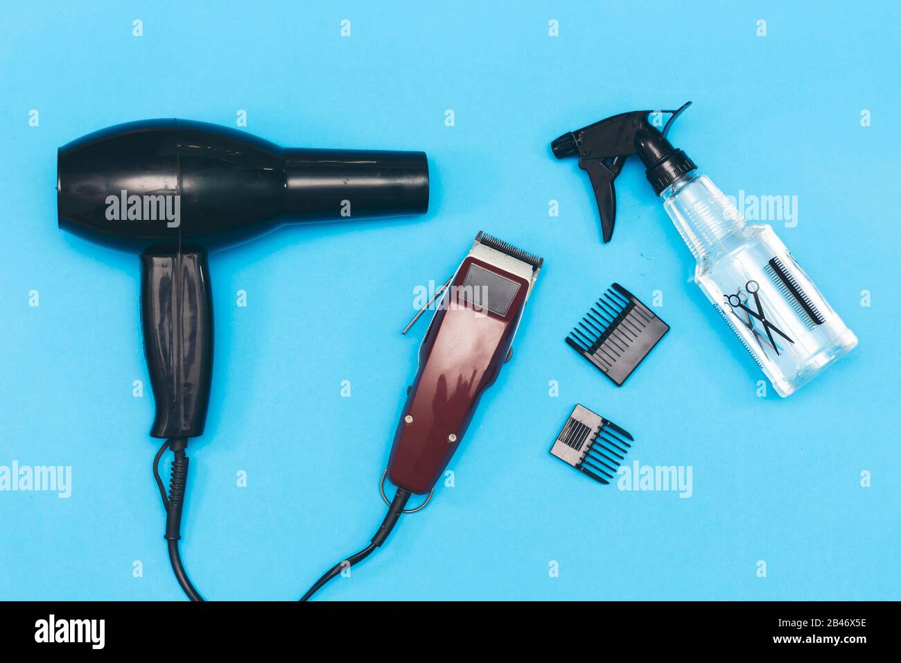 Professional hairdressing tools, machine for a hairstyle. Barbershop. Hair  clippers isolated on blue background. The machine for a hairstyle Stock  Photo - Alamy