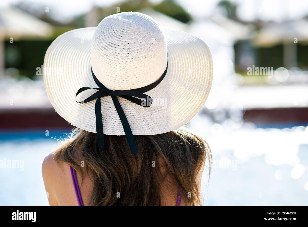 long hair wearing straw hat relaxing 