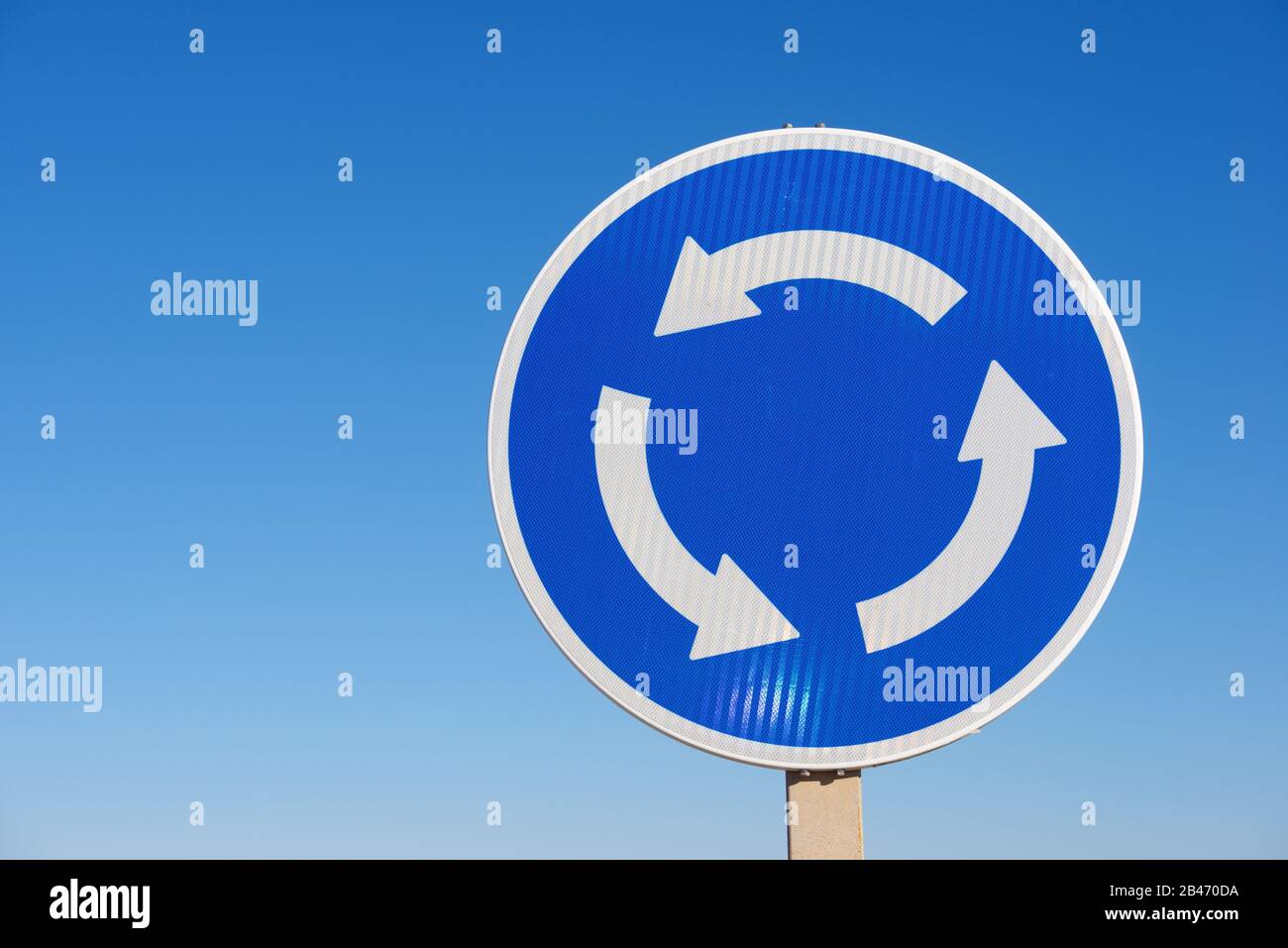 Roundabout traffic sign and clear sky in Spain Stock Photo Alamy