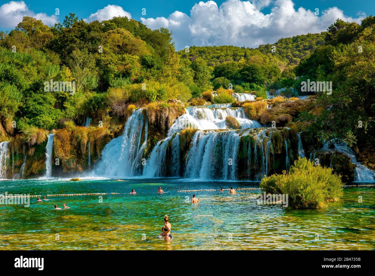 KRKA waterfalls Croatia September , krka national park Croatia on a bright summer evening with people relaxing in the water Stock Photo