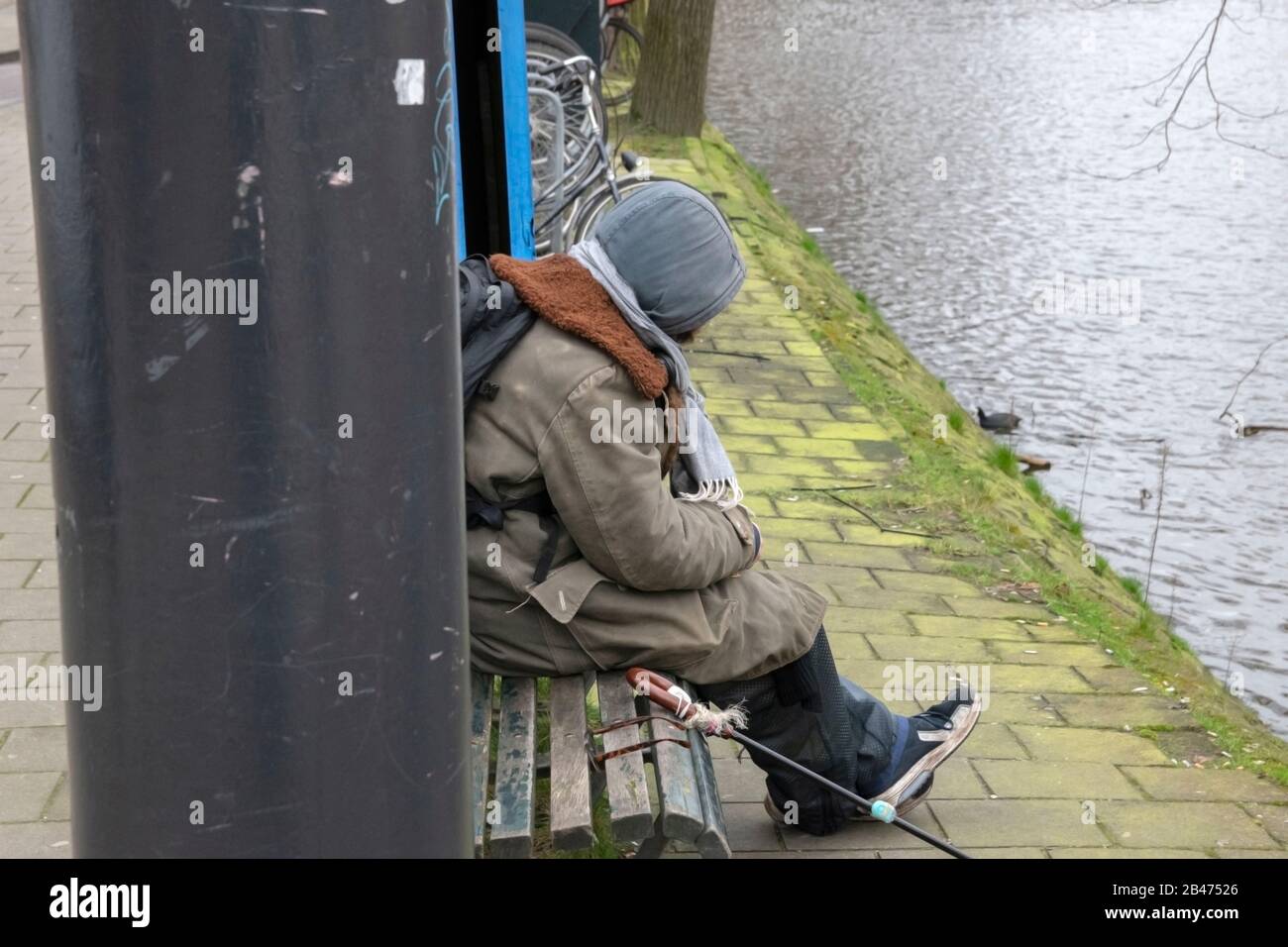 Homeless Man On A Bench At Amsterdam The Netherlands 2020 Stock Photo Alamy