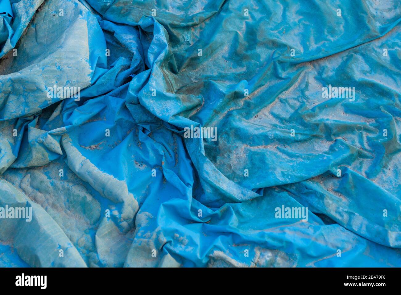 Closeup shot of a wrinkled blue plastic film texture Stock Photo
