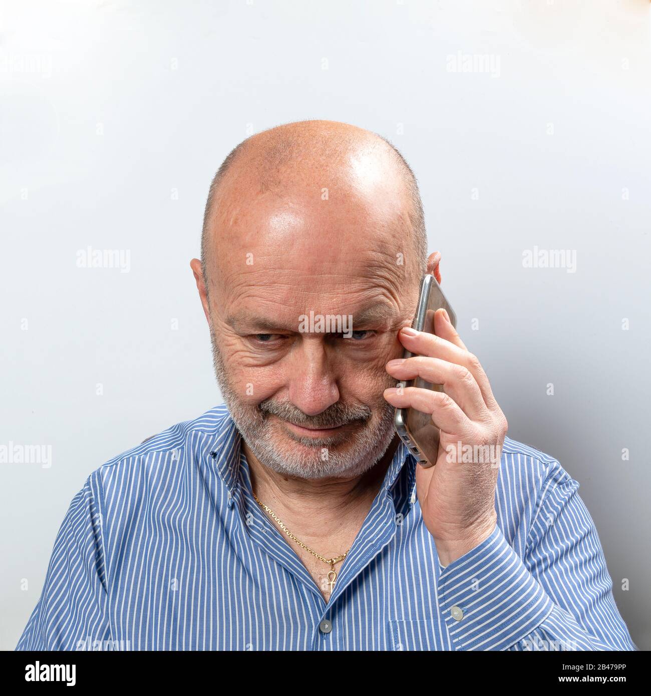A middle-aged man during a cell phone conversation Stock Photo