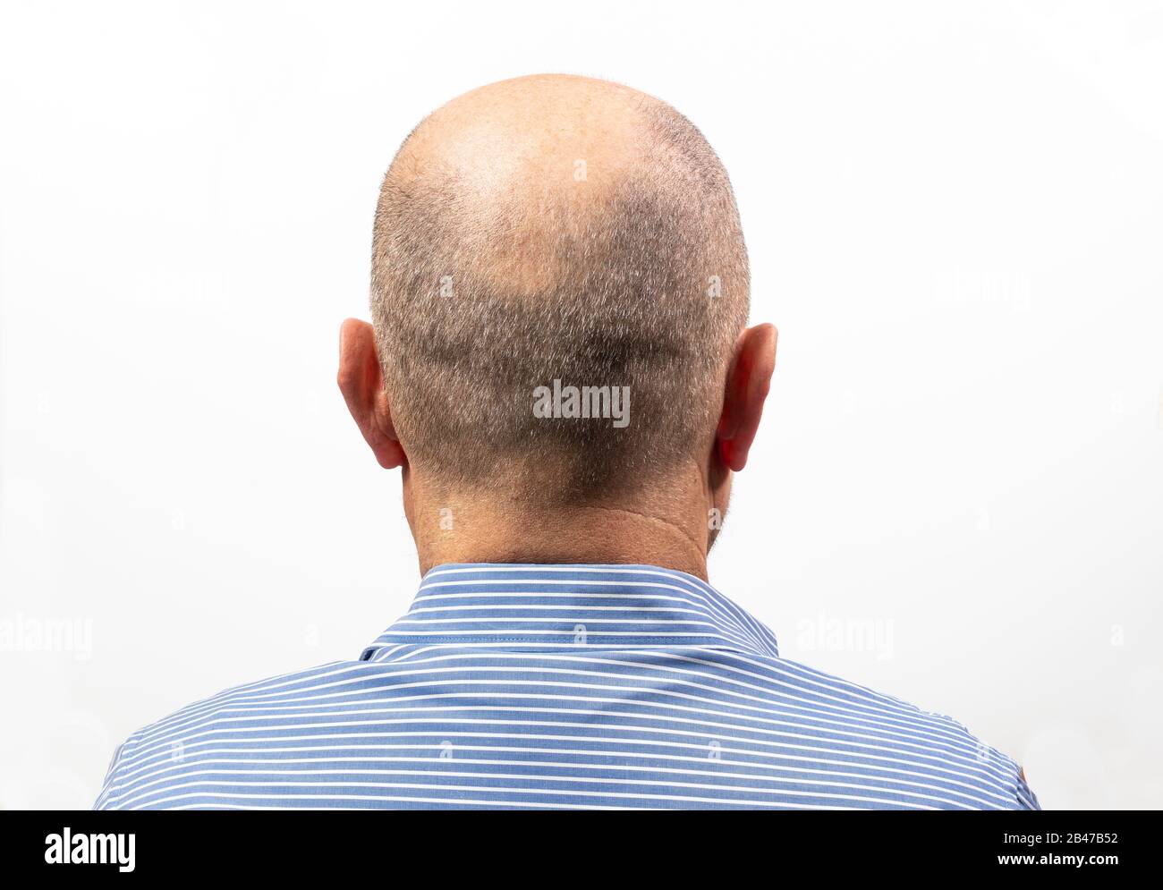 A middle-aged man turned from the back with his shirt on Stock Photo