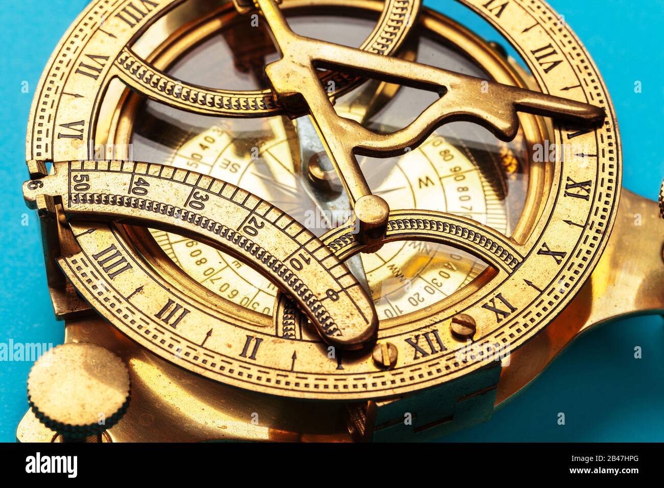 Compass on blue background, top view. creative photo. Stock Photo