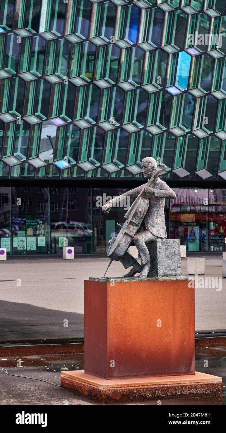 Europe ,Iceland, Reykjavik, View of the bronze statue of Danish cellist Erling Blöndal Bengtsson by sculptor Ólöf Pálsdóttir located in front of the Harpa Concert Hall,Architect: Henning Larsen Architects and Ólafur Stock Photo