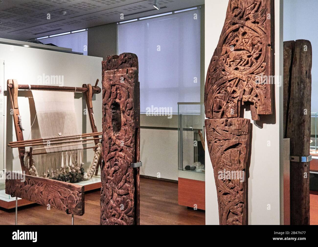Reykjavik, The National Museum of Iceland, part of old church doors, mixture of paganism and the beginnings of Christianity in wood carving Stock Photo