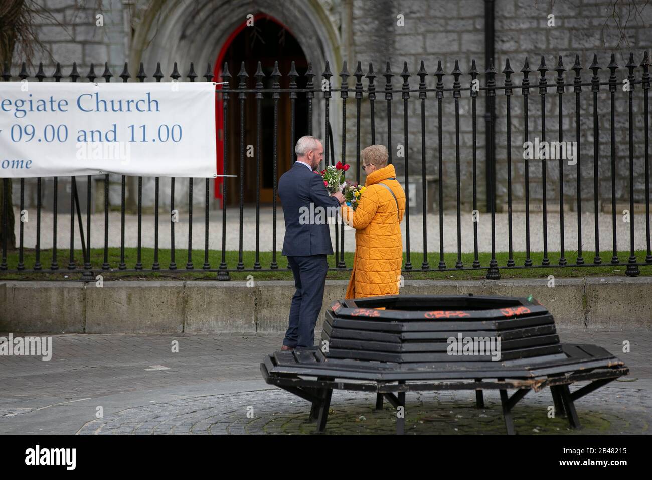 Flowers received by The Duke & Duchess of Cambridge on their walkabout outside Tig Cóilí  Bar in Galway are handed over to a waiting Aide. Stock Photo