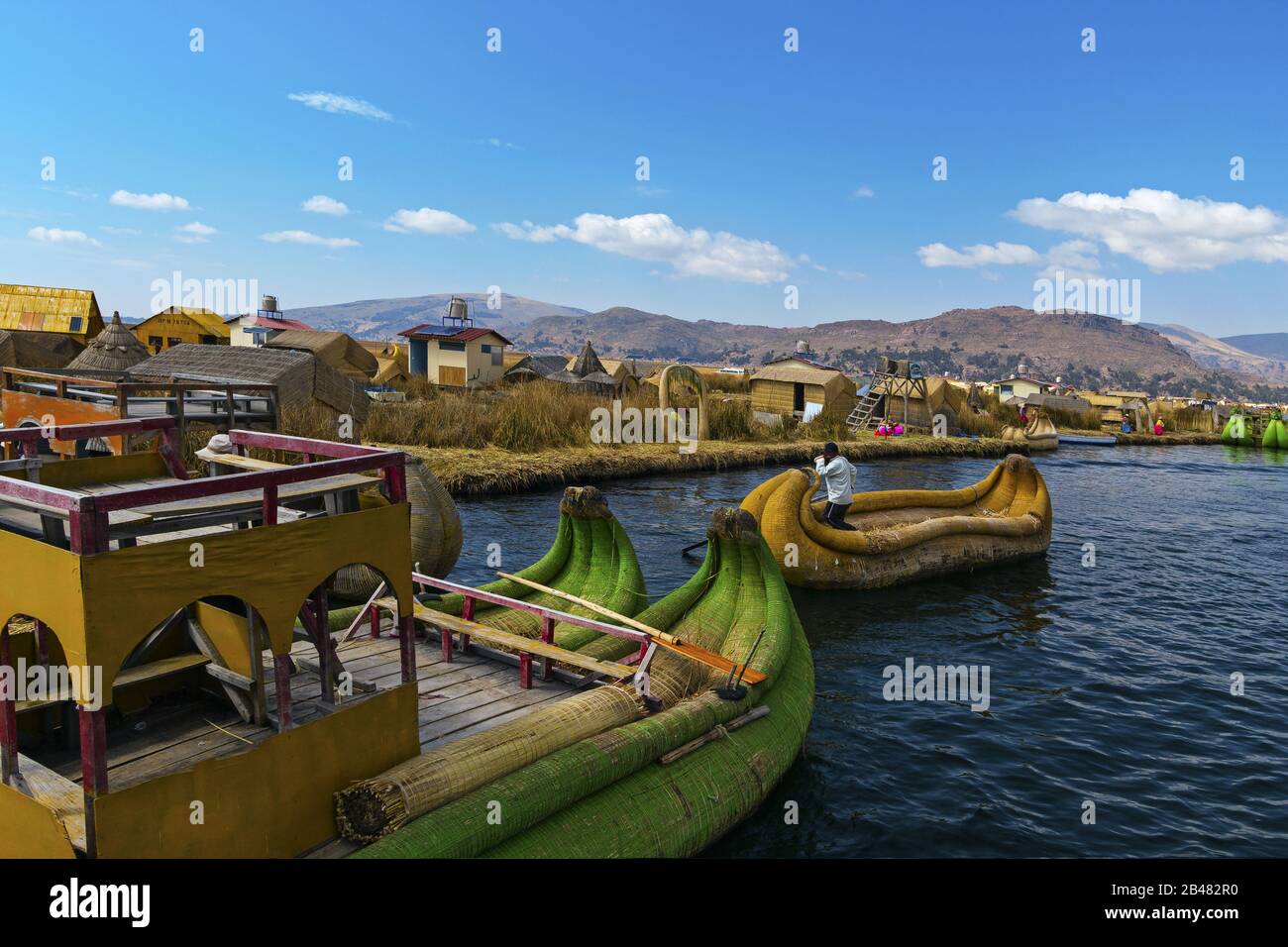 View of Uros floating islands with typical boats, Puno, Peru Stock Photo