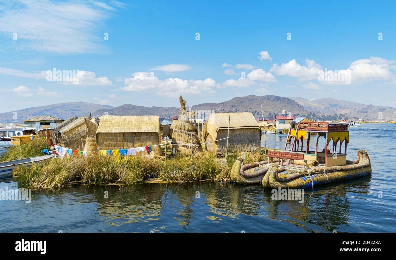 View of Uros floating islands with typical boats, Puno, Peru Stock Photo