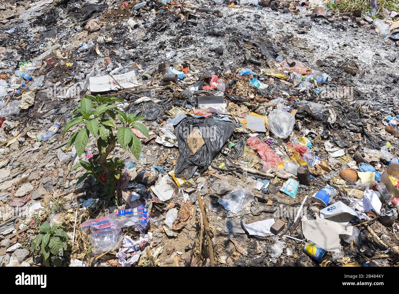 Nuwara, Sri Lanka: 03/20/2019: Discarded rubbish burnt and left in the open  - environmental hazard. Stock Photo