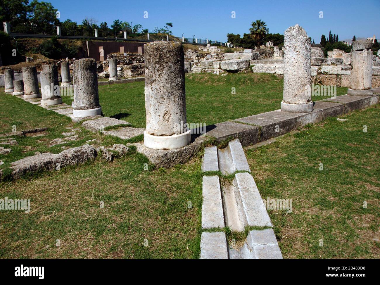 Greece, Athens. Area of Kerameikos (Ceramicus). Its name derives from 'potter's quarter'. Northwest of the Acropolis. View of the Pompeion, the public classical building, 4th century BC, where the sacral items used at the Panathenaic procession were kept. Stock Photo