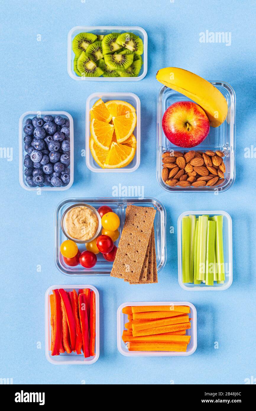 Healthy meal prep containers with fruits, berries, snacks and vegetables.  Takeaway food on white background, top view. Lunch box to school Stock  Photo - Alamy