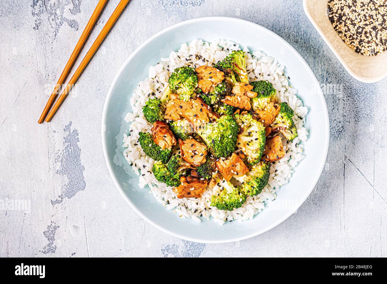 Fried tempeh with rice and broccoli, traditional indonesian cuisine