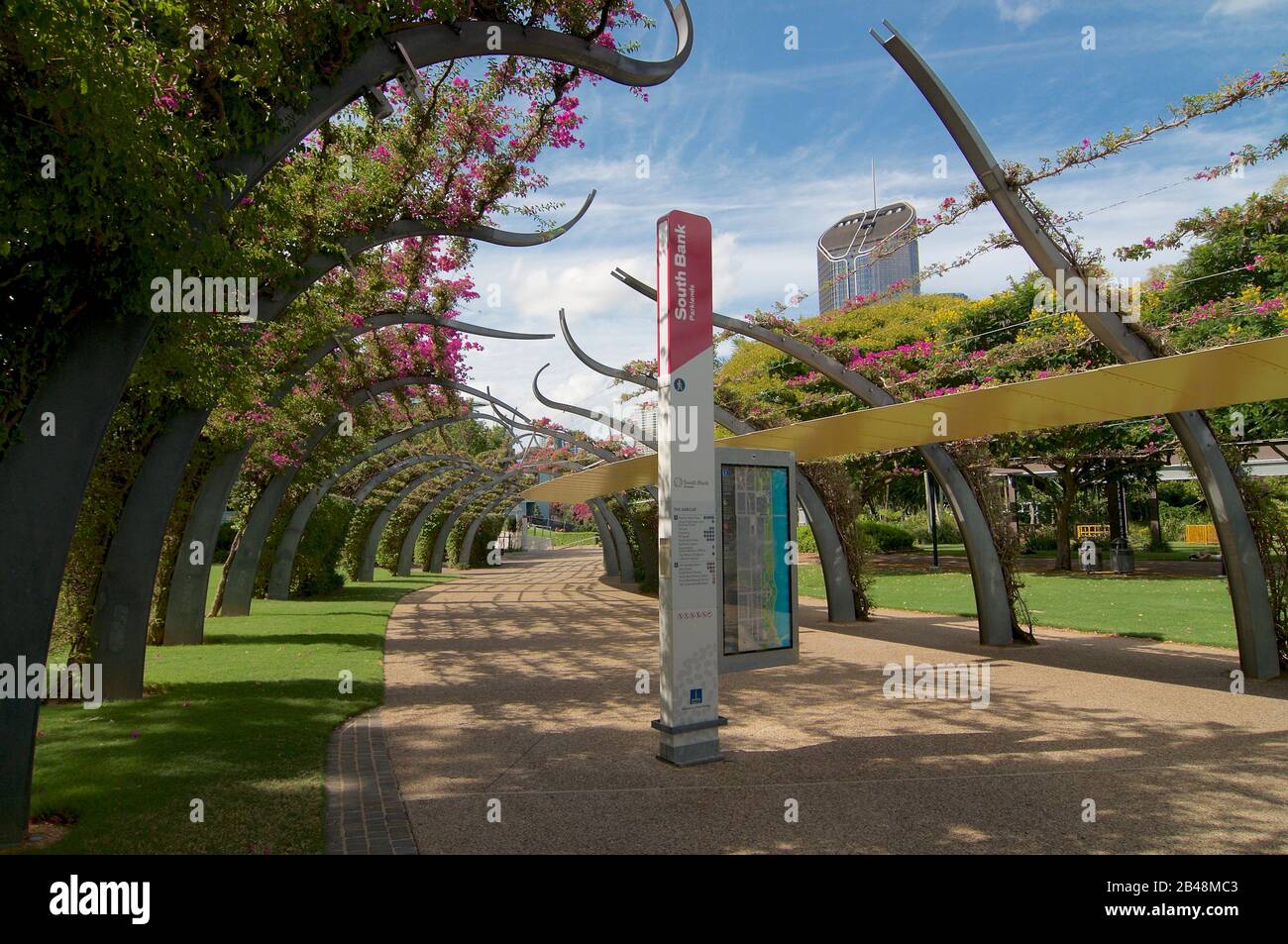 View of the Grand Arbour structure covered by blooming Bouganvillea flowers in South Bank parklands in Brisbane. The structure functions as a pedestri Stock Photo