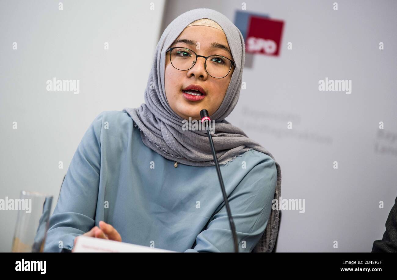 Munich, Bavaria, Germany. 6th Mar, 2020. SHAHNURA KASIM, a Munich-based Uyghur who displayed photos of family members who have gone missing in the Xinjiang Province of China. Held in the Bavarian Landtag, Markus Rinderspacher of the SPD and Asgar Can of the Uigurischen Gemeinde Europa e.V., discussed the situation in the Xinjiang Province of China. Potentially 11 million Uyghurs live under oppression in China with 150 of the largest concerns in Europe have economic interests in the region and Uyghurs in their supply chain, such as Nike, Volkswagen, Apple, BMW, Samsung, Huawei, Sony, and othe Stock Photo