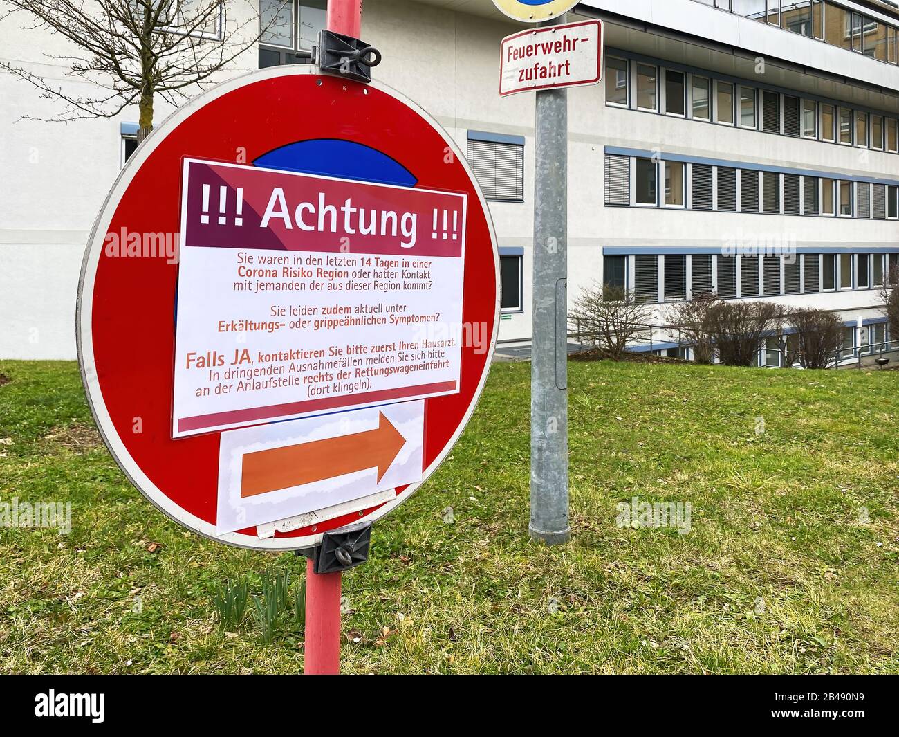 Attention Sign in a german Hospital - Coronavirus Covid-19 Stock Photo