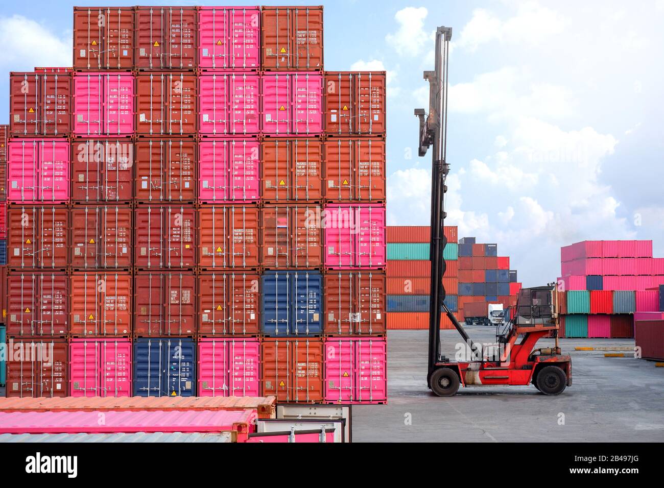 Container handlers and trucks In the loading and unloading yard Stock ...