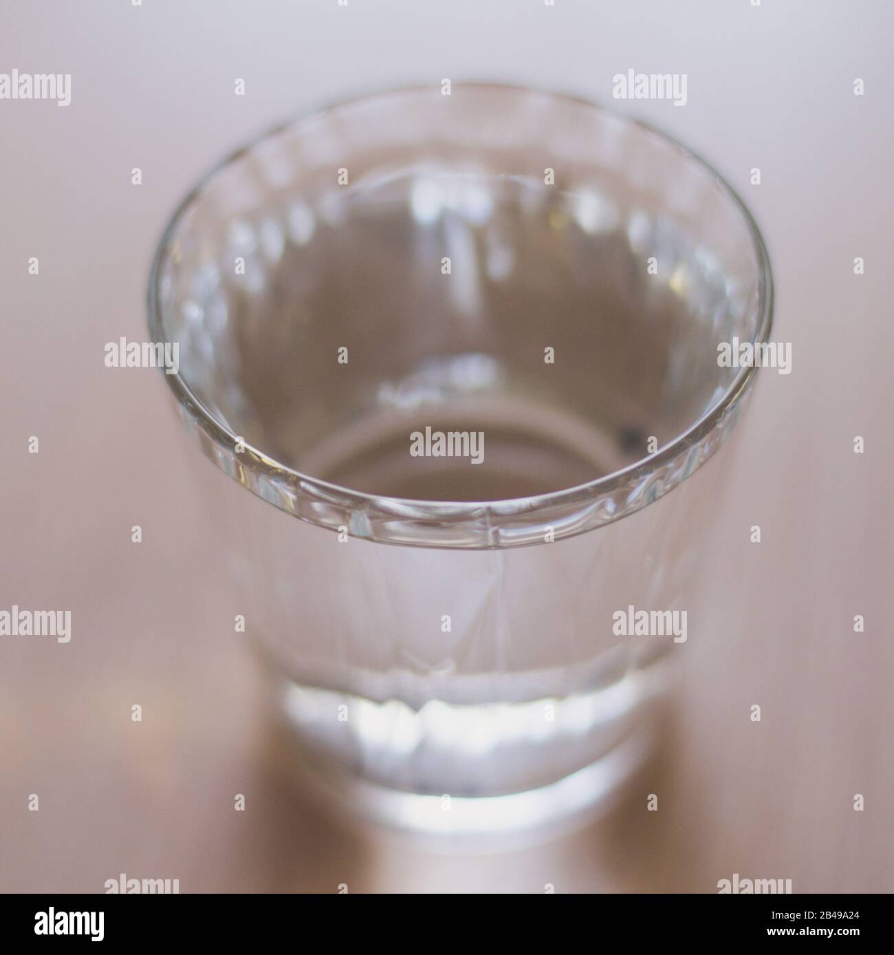 Full glass of water on the light wooden table Stock Photo